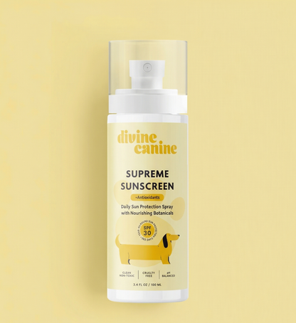 Divine Canine Supreme Sunscreen 3.4 fl oz spray bottle on yellow background