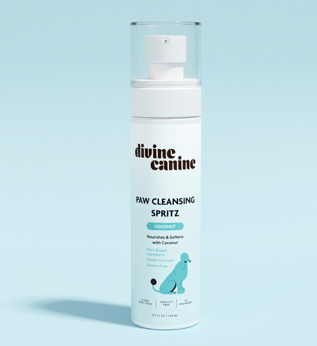 Divine Canine Paw Cleansing Spritz with coconut bottle, front view on a light blue background