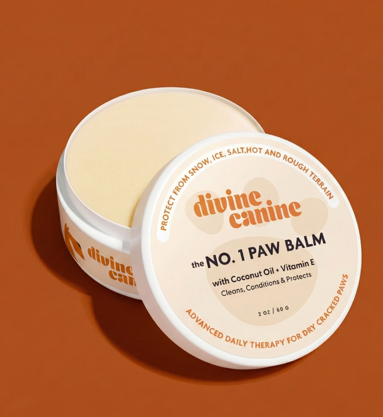 Divine Canine No. 1 Paw Balm tin open showing balm on a brown background