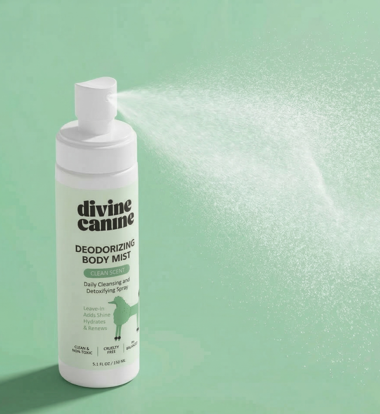 Deodorizing Body Mist bottle spraying mist on green background