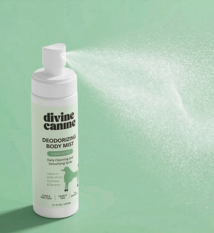 Deodorizing Body Mist bottle spraying mist on green background