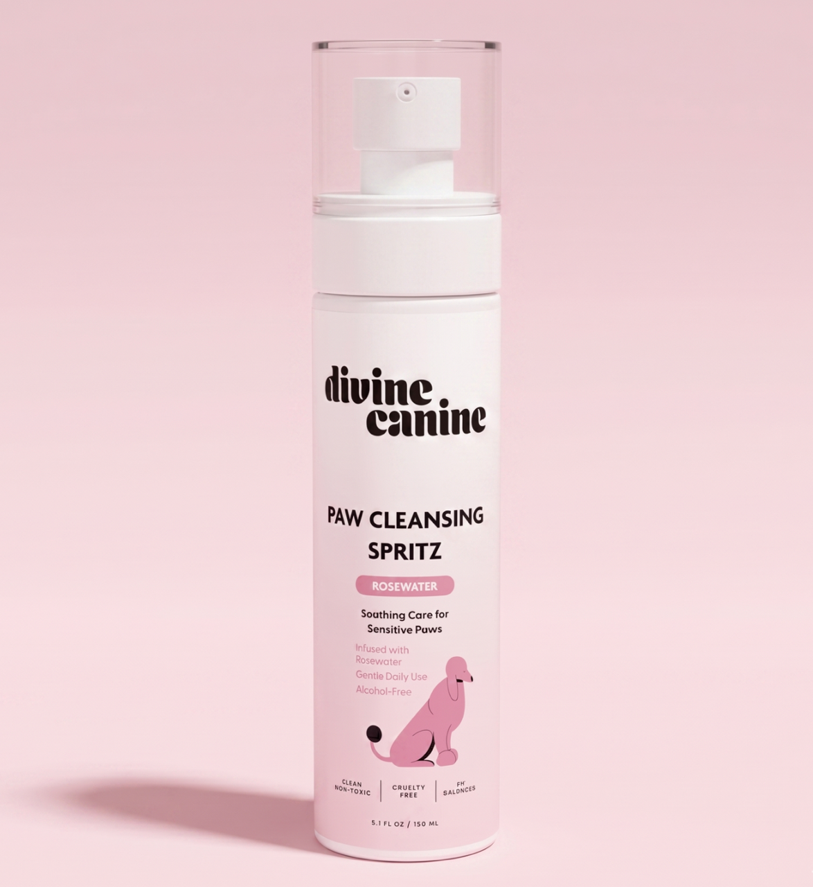 Divine Canine Paw Cleansing Spritz with rosewater bottle on a pink background