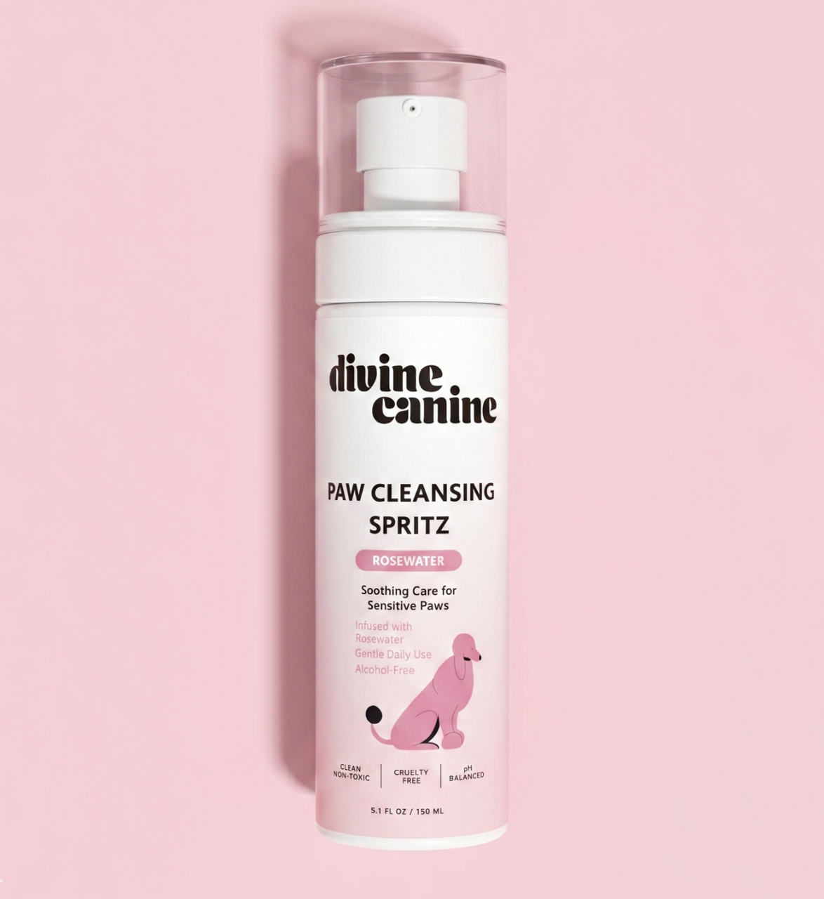 Divine Canine Paw Cleansing Spritz with rosewater bottle lying on a pink background